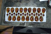Tray with 17 honey amber chandelier drops in two-piece configuration