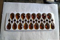 Tray with 17 honey amber faceted teardrop chandelier crystals