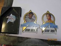 Front of both porcelain trading cards with box