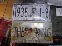 Both sealed Elvis Presley license plates side by side