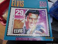 Front of 550-piece Elvis stamp puzzle box