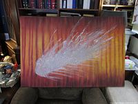 Full view of painting on chair showing scale and colors