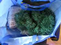Bag containing garland and ribbon