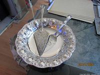 Bowl holding both cake servers