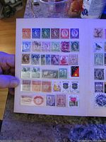 Open album page showing first selection of worldwide stamps