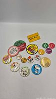 Full lot overview of 17 pinback buttons