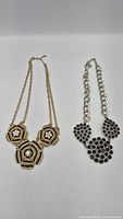 Both necklaces laid flat for overview