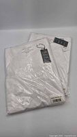 Two sealed packs of Britches white T-Shirts