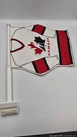 Front view of the jersey-shaped Hockey Canada car flag on mount