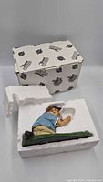 Figurine in styrofoam inside branded outer box