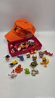 Overview of cap and tray with toys spread out
