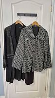 Both jackets hanging on door to show full view and length