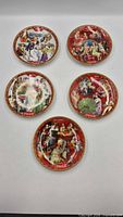 All five Coca-Cola month plates arranged