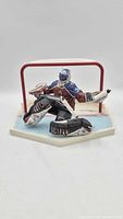 Front view of Patrick Roy action figure in goal stance on base