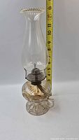Full view of lamp beside tape measure showing height
