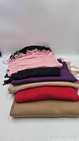 Stack showing all six scarves folded