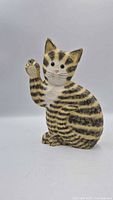 Full front view of carved wooden cat