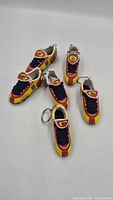 Group view of all six Spain soccer cleat keychains