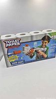 Front of boxed Toilet Paper Blasters Skid Shot showing product image and features