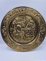 Front view of first brass plaque showing full design