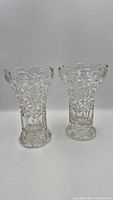 Front view of both crystal vases showing overall design