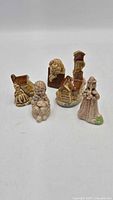 Group view of six Wade nursery rhyme figurines