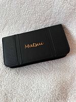 Closed black Matsui case