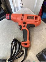 Left side view of Black & Decker DR250 corded drill with power cord