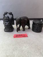 Front view of all three items together: Buddha figurine, elephant figurine, trinket box closed