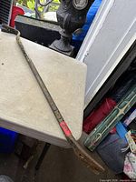 Full view of crowbar on table