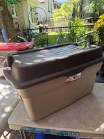 Angled view of closed Rubbermaid Roughneck tote