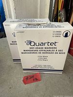 Two sealed boxes of Quartet dry-erase markers showing front panel details
