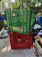 Green crate stacked on red Silverwood crate outdoors