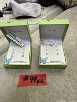 Two Lake + Gray earring sets in boxes showing contents