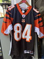 Front view of Cincinnati Bengals jersey #84 hanging on hanger