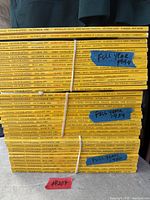 Stacked yellow-spine National Geographic magazines grouped and labelled by year