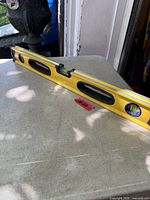 Full view of yellow Swanson magnetic level on table