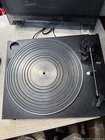Top view of Fisher turntable showing platter, tonearm, condition