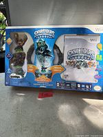Front view of sealed Skylanders Spyro's Adventure Starter Pack box showing figures and Wii branding