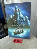Front cover of The Good Thieves paperback showing title and art
