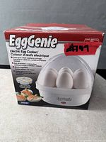 Retail box of Emson EggGenie electric egg cooker showing product image and specifications
