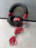 Front view of Halion Cobra S4 headphones showing headband, ear pads and coiled cable