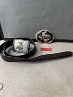 Black leather belt with two buckles overview