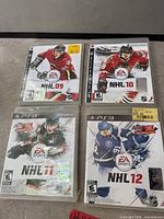 Front view of four PS3 NHL game cases arranged together
