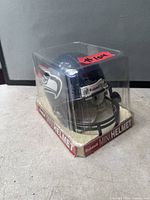 Mini helmet front view in sealed box