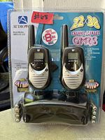 Front view of sealed package showing two radios and branding