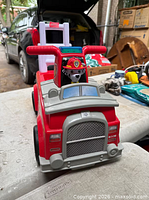 Front angle showing overall fire truck design, handlebars, light bar, Marshall figure