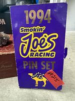 Front of purple sleeve showing 1994 Smokin' Joe's Racing Pin Set branding