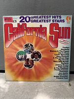 Front cover of California Sun 20 Greatest Hits LP showing title and design