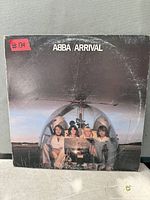 Front cover of ABBA Arrival LP showing title and artwork